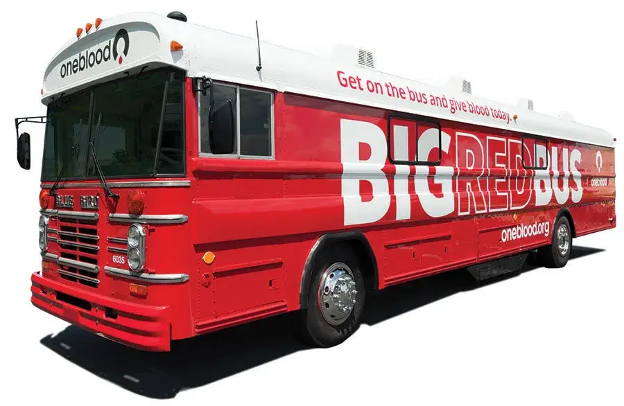 Red bus for blood donations with OneBlood branding
