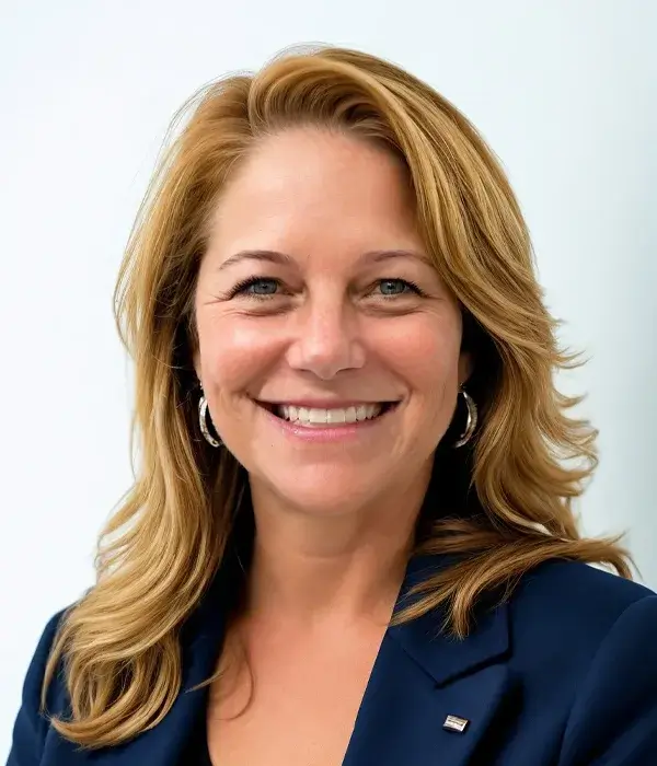 Paula smiling in business attire portrait